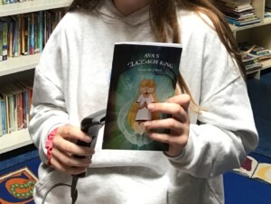 Georgia - Mai O Boyle adds a copy of her book to Scoil Chaitríona Senior Library. We are sure the children in the coming years will enjoy reading this wonderful book.